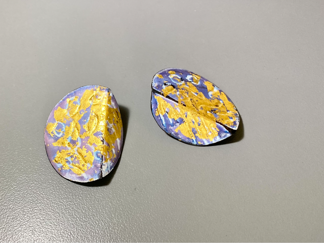 Enameled earring with gold leaf